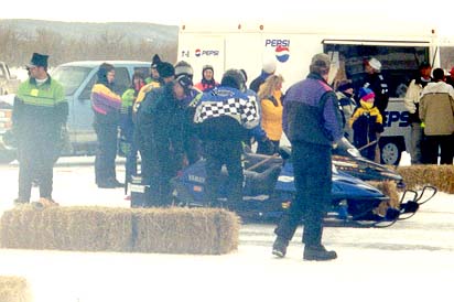 Here we are, at the line (still in Devils Lake) warming the sled to make our first run.