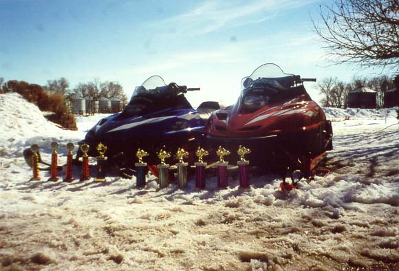 The sleds with 2000-2001 trophies.